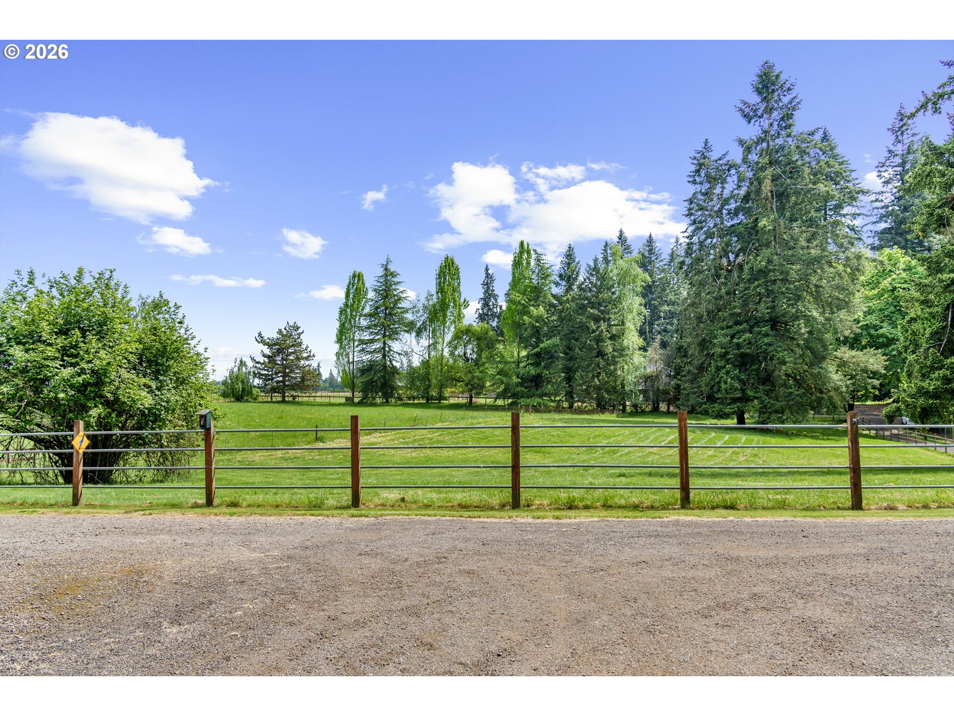 12737 Northeast Cedarbrook Road Aurora, OR 97002 - Photo 45 of 48 a view of a yard with wooden fence