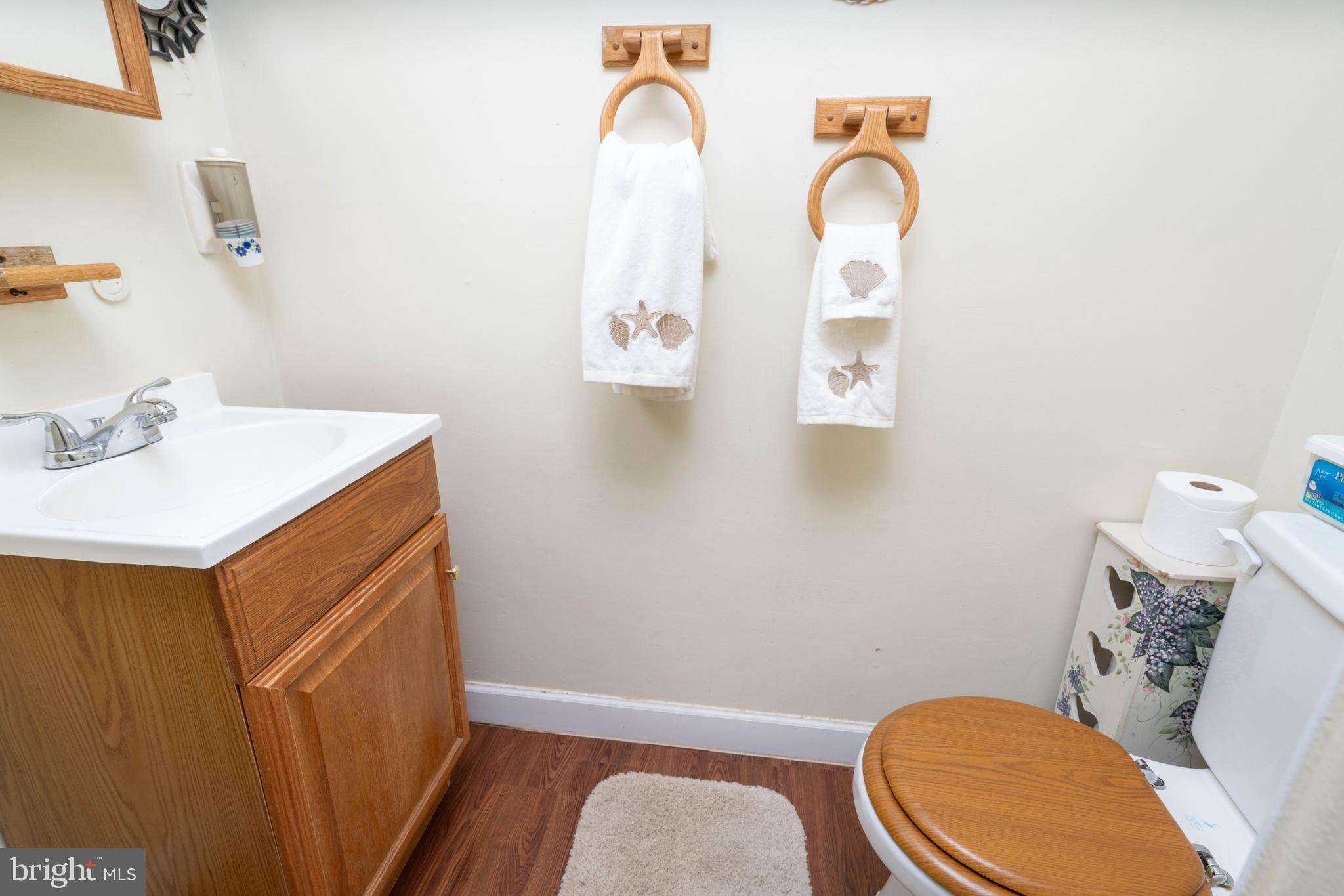 24 Magnolia Court Sicklerville, NJ 08081 - Photo 12 of 22 a bathroom with a sink mirror vanity and toilet