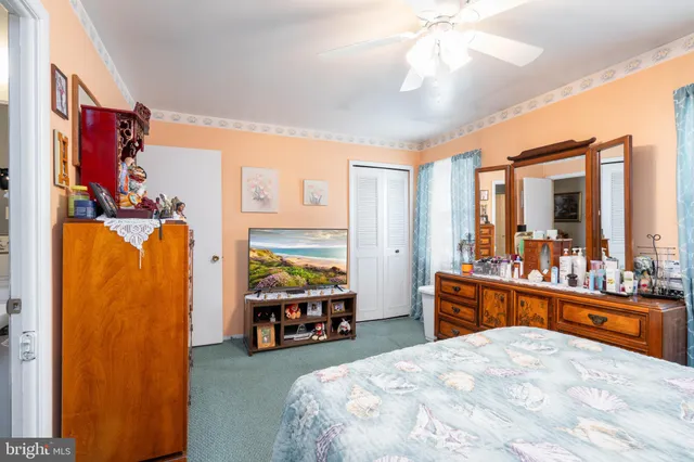 a room with furniture a flat screen tv and a window