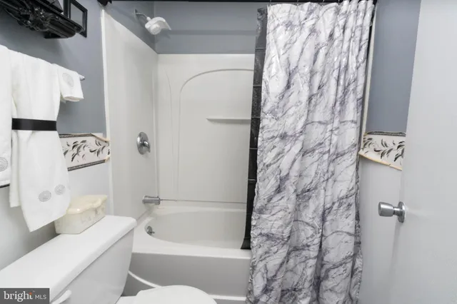 a bedroom with a bed and a closet