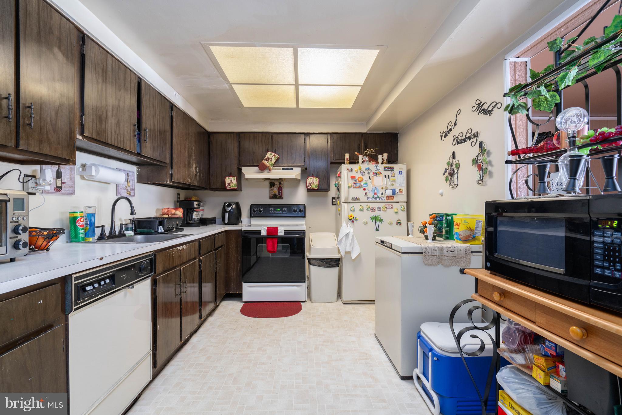 24 Magnolia Court Sicklerville, NJ 08081 - Photo 5 of 22 a kitchen with stainless steel appliances a stove a sink dishwasher and cabinets