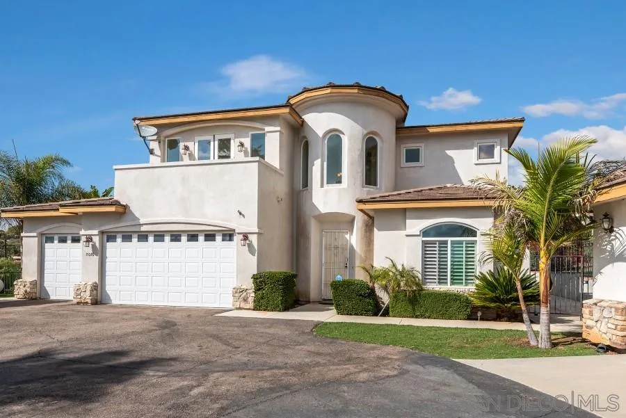 15076 Eastvale Road Poway, CA 92064 - Photo 1 of 35 a front view of a house with a yard