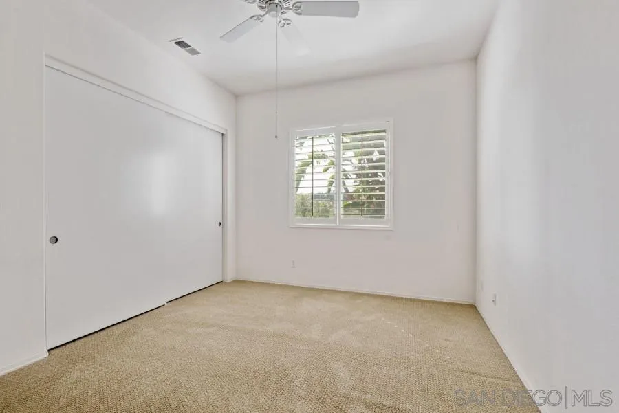 15076 Eastvale Road Poway, CA 92064 - Photo 17 of 35 an empty room with a empty space and windows