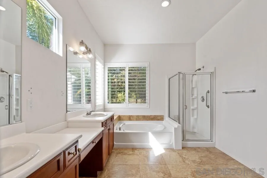 15076 Eastvale Road Poway, CA 92064 - Photo 23 of 35 a spacious bathroom with sink shower and bathtub
