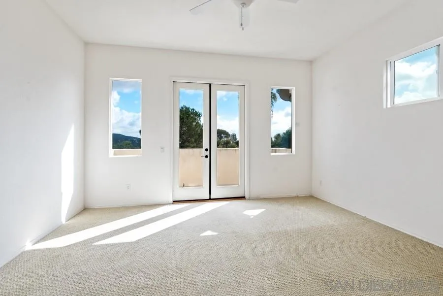 15076 Eastvale Road Poway, CA 92064 - Photo 26 of 35 an empty room with windows