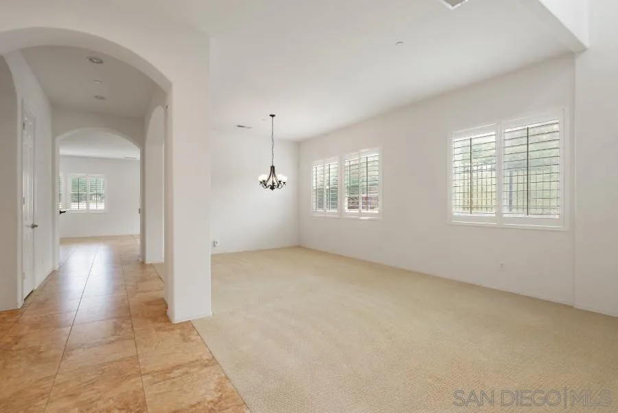 15076 Eastvale Road Poway, CA 92064 - Photo 4 of 35 an empty room with windows and closet