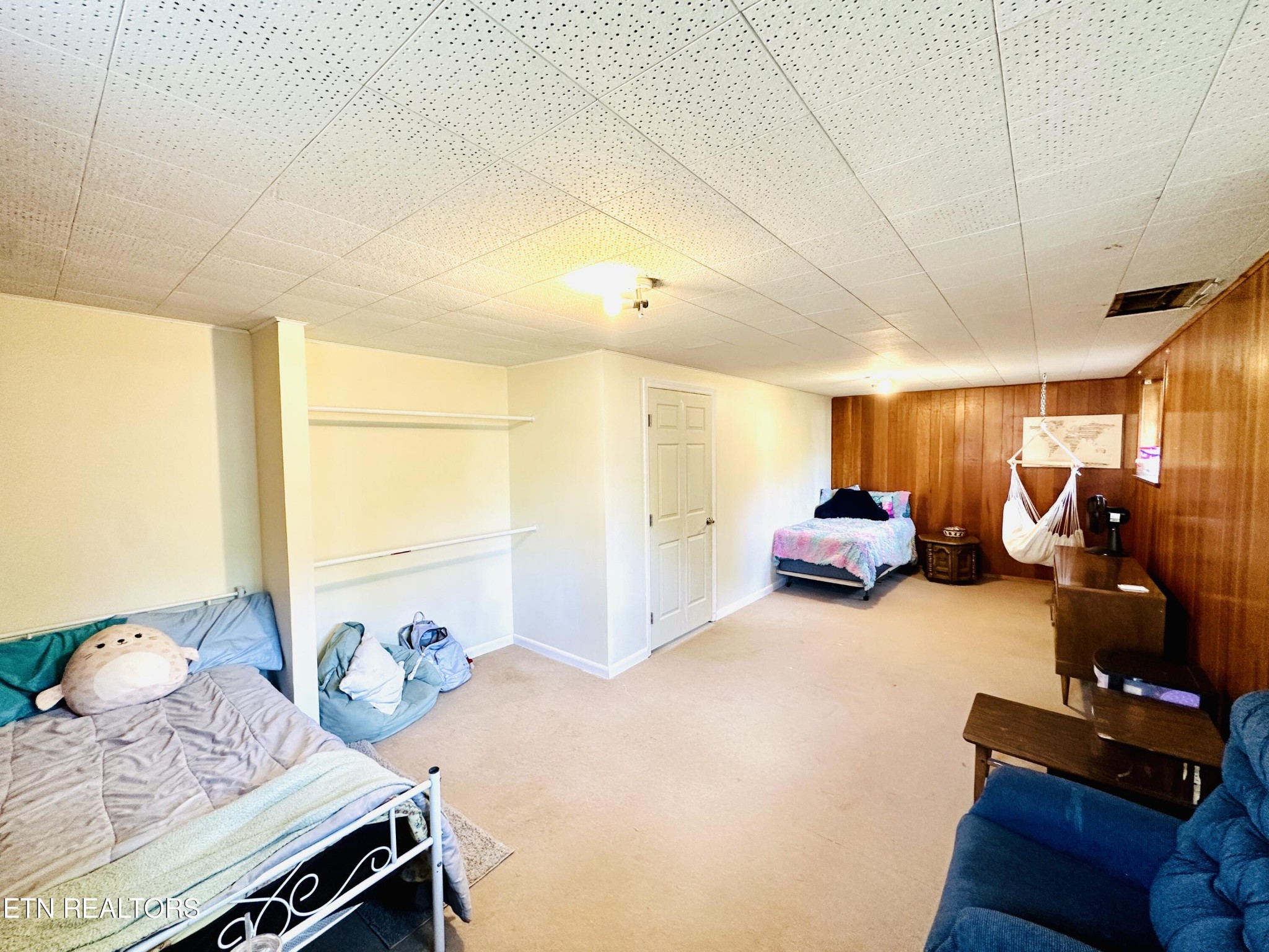 4428 Royalview Road Knoxville, TN 37921 - Photo 14 of 18 a bedroom with furniture and a chandelier