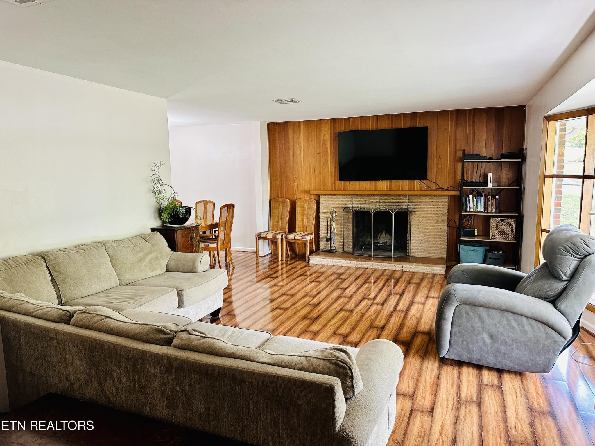 4428 Royalview Road Knoxville, TN 37921 - Photo 2 of 18 a living room with furniture flat screen tv and a fireplace