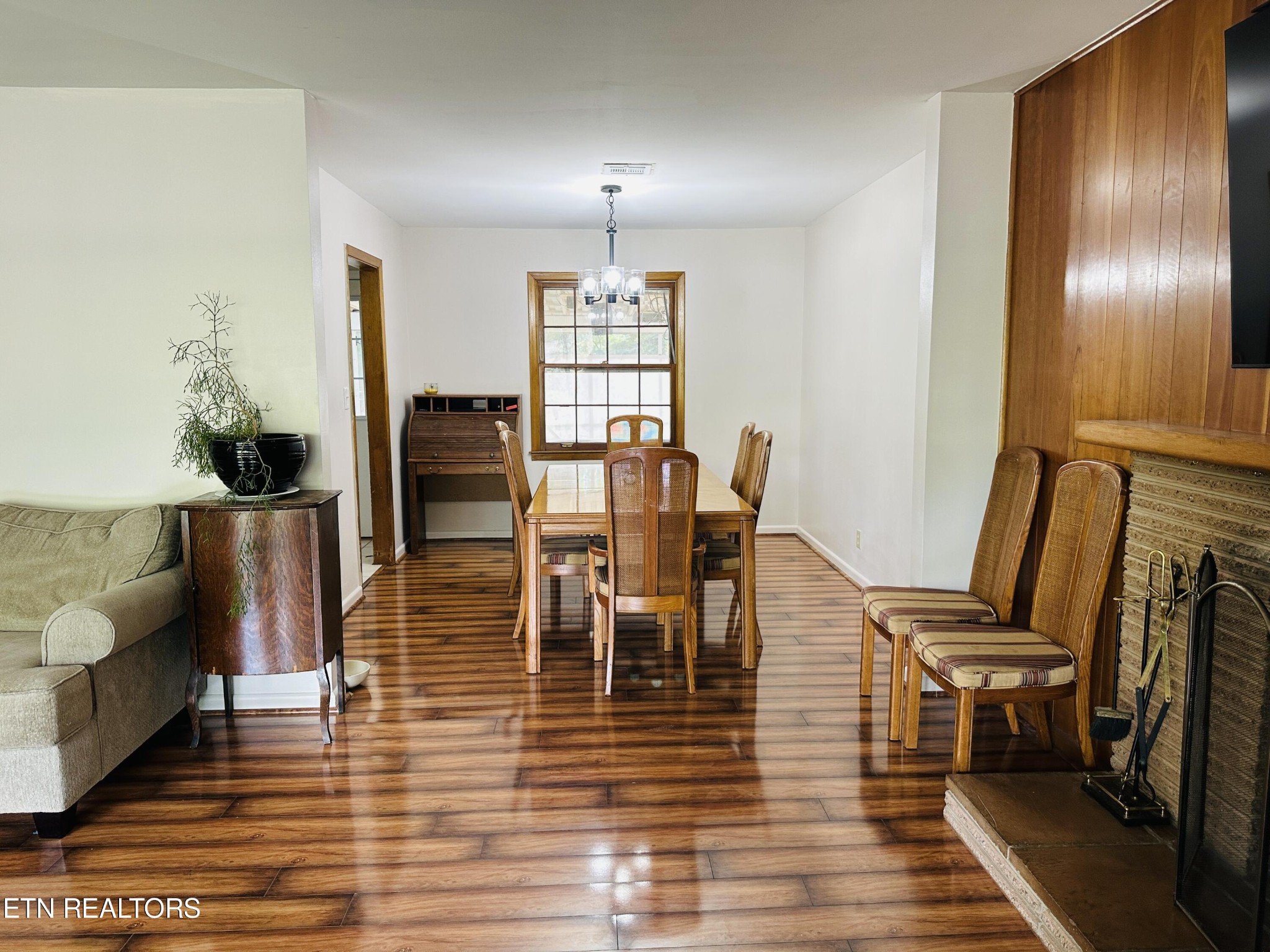 4428 Royalview Road Knoxville, TN 37921 - Photo 4 of 18 a view of a dining room with furniture and wooden floor
