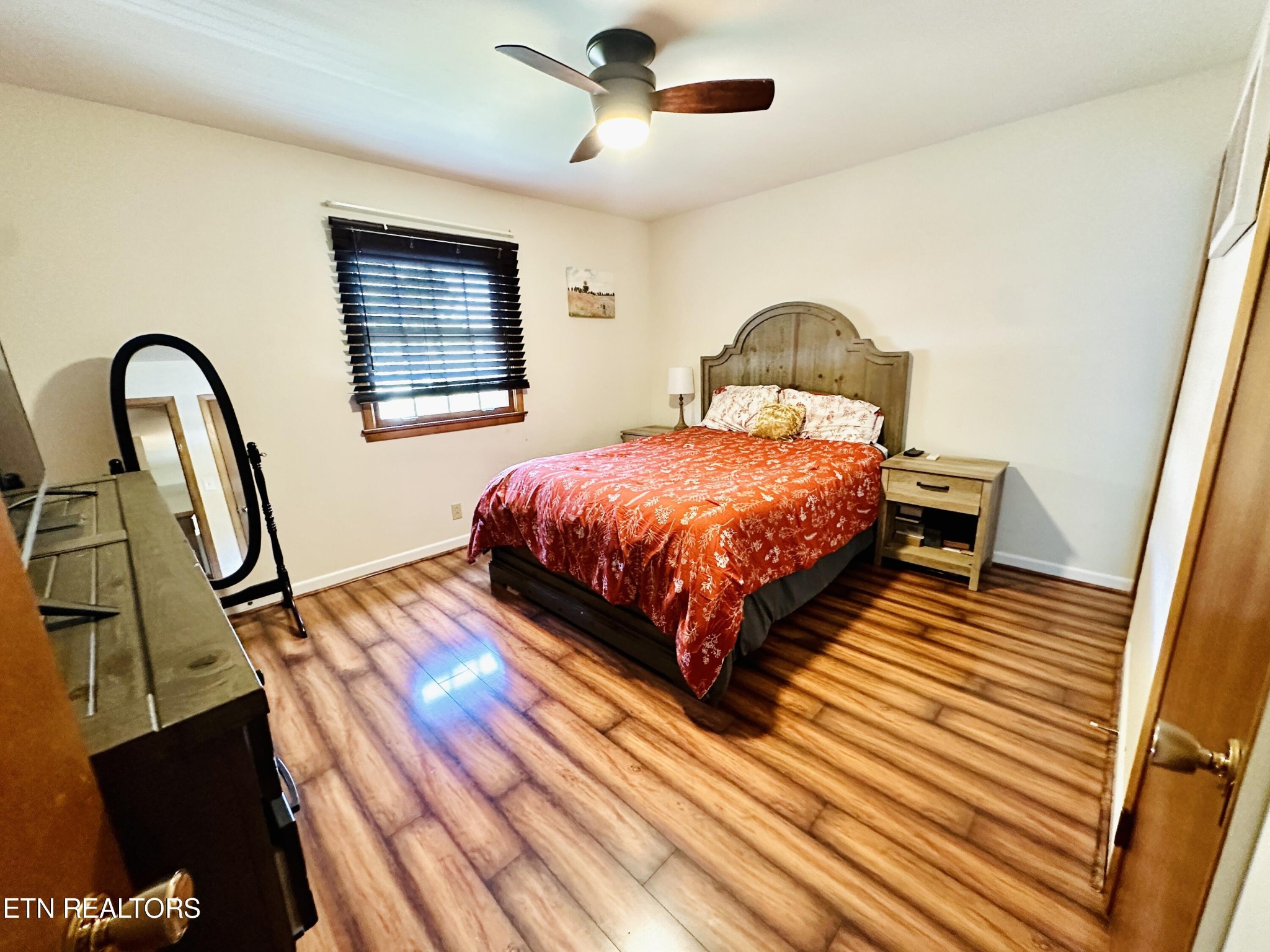 4428 Royalview Road Knoxville, TN 37921 - Photo 8 of 18 a bedroom with a bed window and dresser