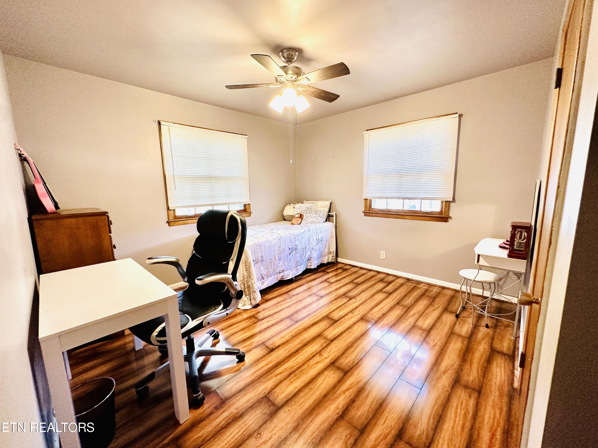 4428 Royalview Road Knoxville, TN 37921 - Photo 10 of 18 a bedroom with a bed and wooden floor