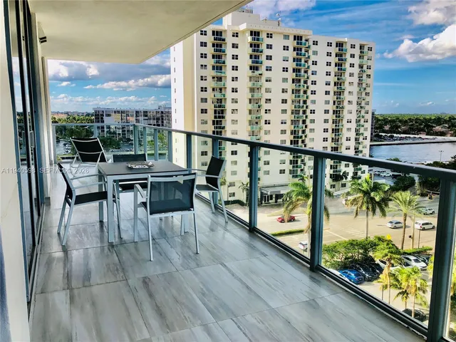 a view of a balcony with chairs