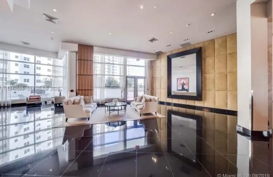 a very nice looking living room with a large window