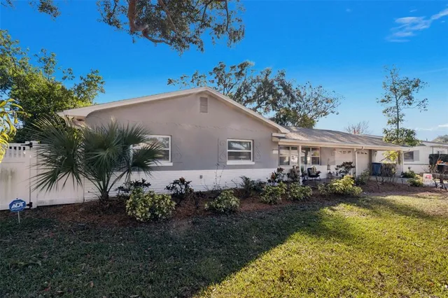 a aerial view of a house with swimming pool garden and patio