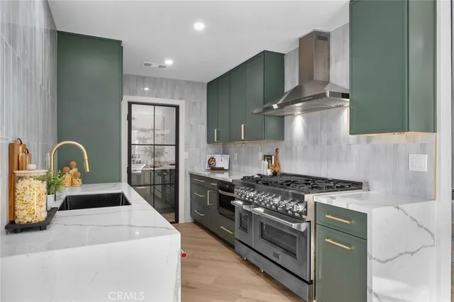a kitchen with a stove and a sink