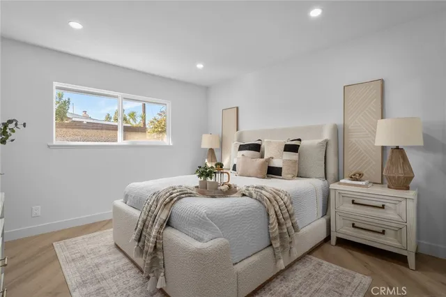 a bed room with a bed and a lamp