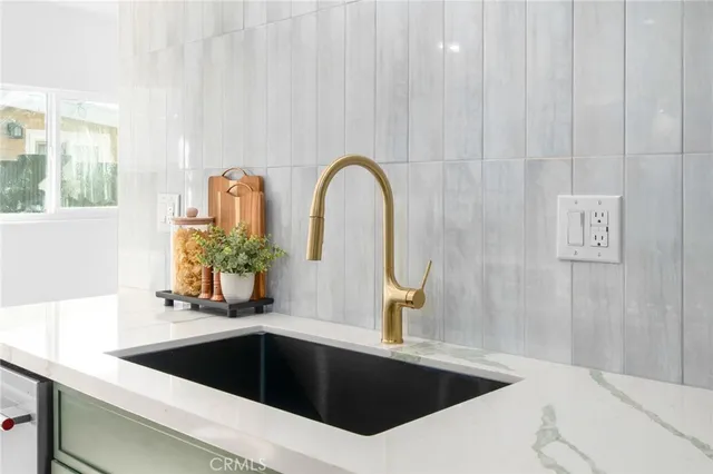 a kitchen with a sink and a bathtub