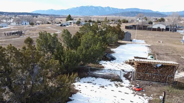 a view of a town with mountains in the background