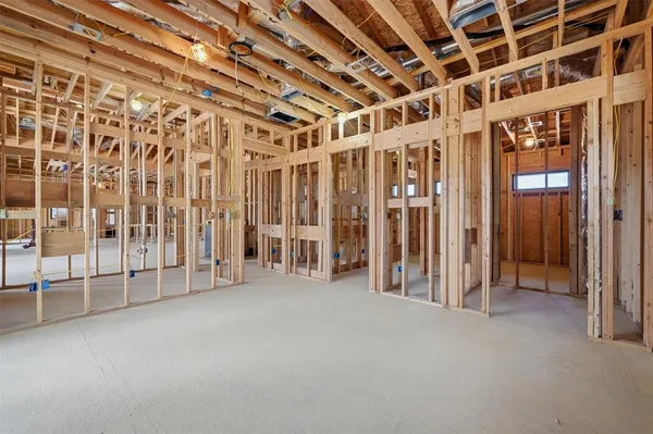 a view of empty room with wooden ceiling