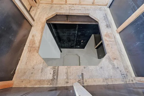 a view of a room with wooden walls