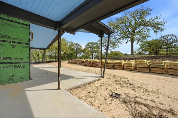 a view of a backyard of the house