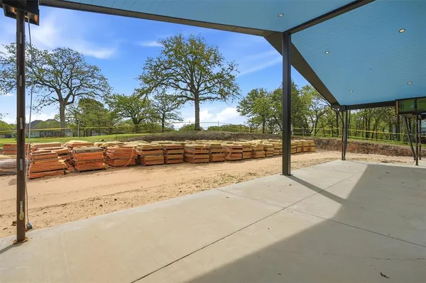 a view of a swimming pool with a patio