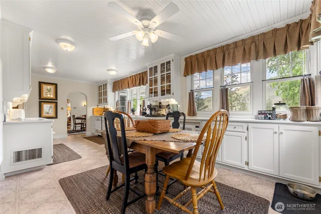 a dining room with furniture window wooden floor