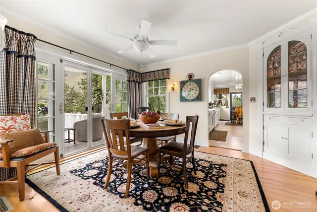 a view of a dining room with furniture window and wooden floor