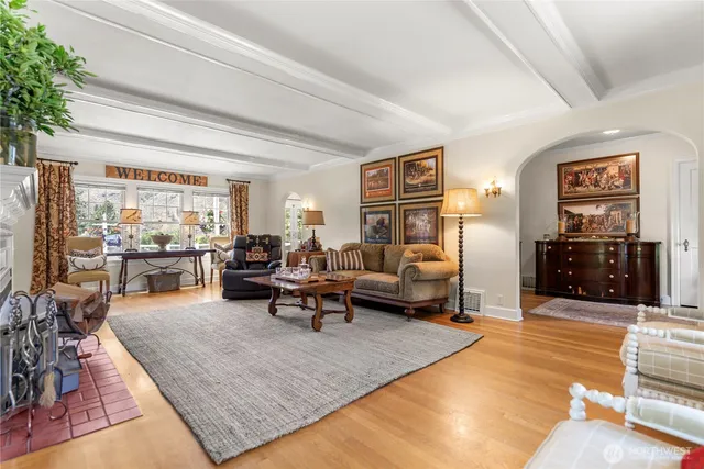 a living room with furniture rug and window