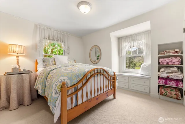 a bedroom with a bed and a window in it