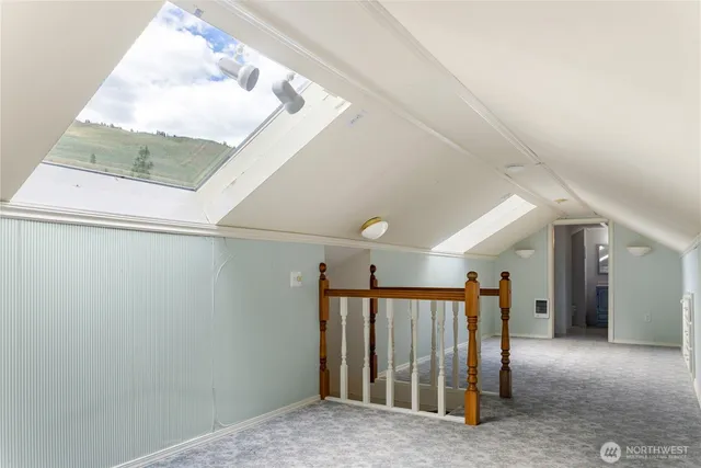 a view of a hallway view with staircase