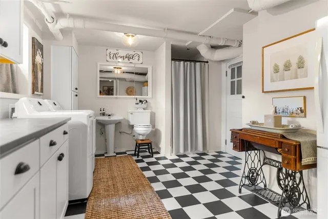 a spacious bathroom with a sink and a mirror