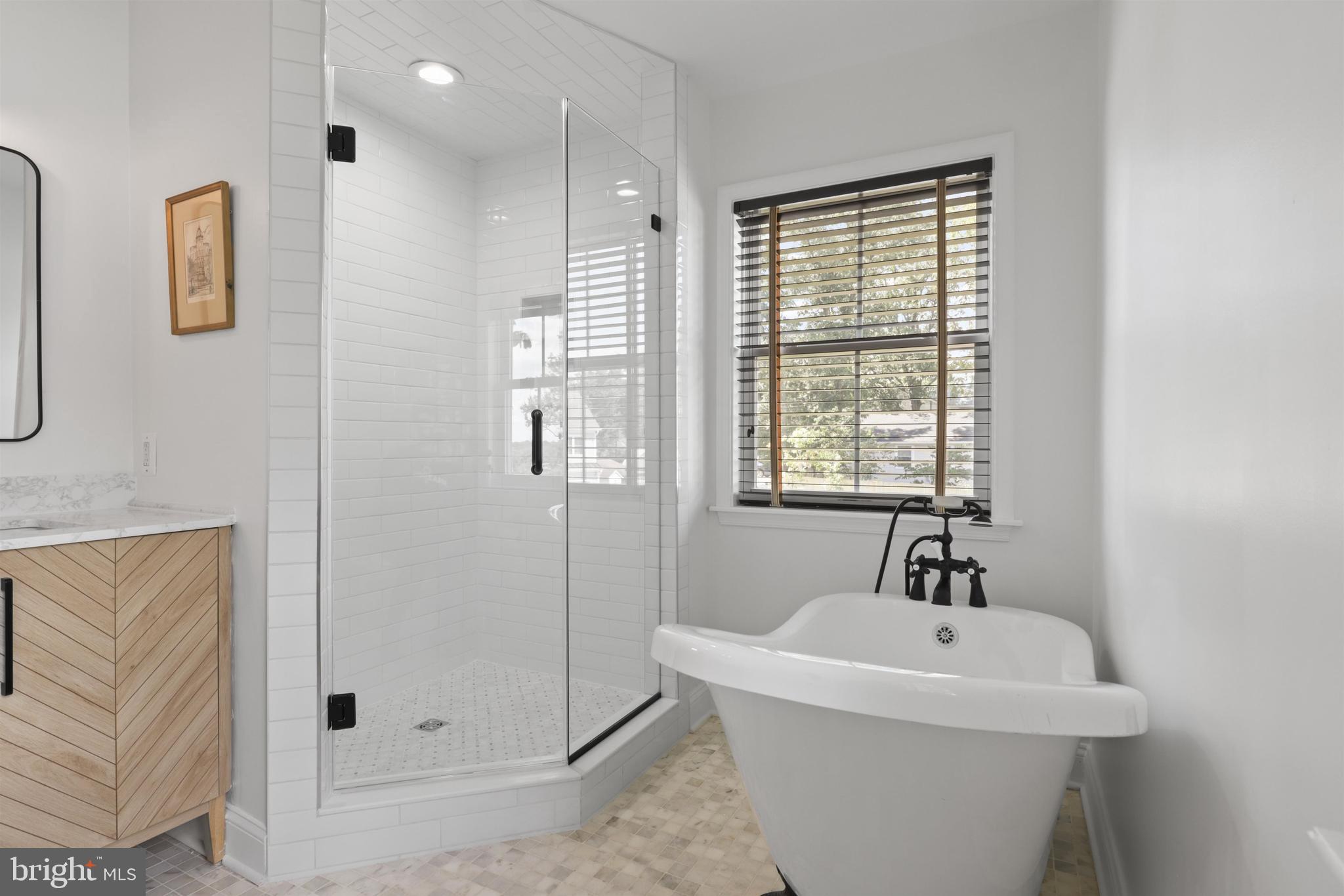 438 Ethan Allen Avenue Takoma Park, MD 20912 - Photo 13 of 47 a white bath tub sitting next to a window