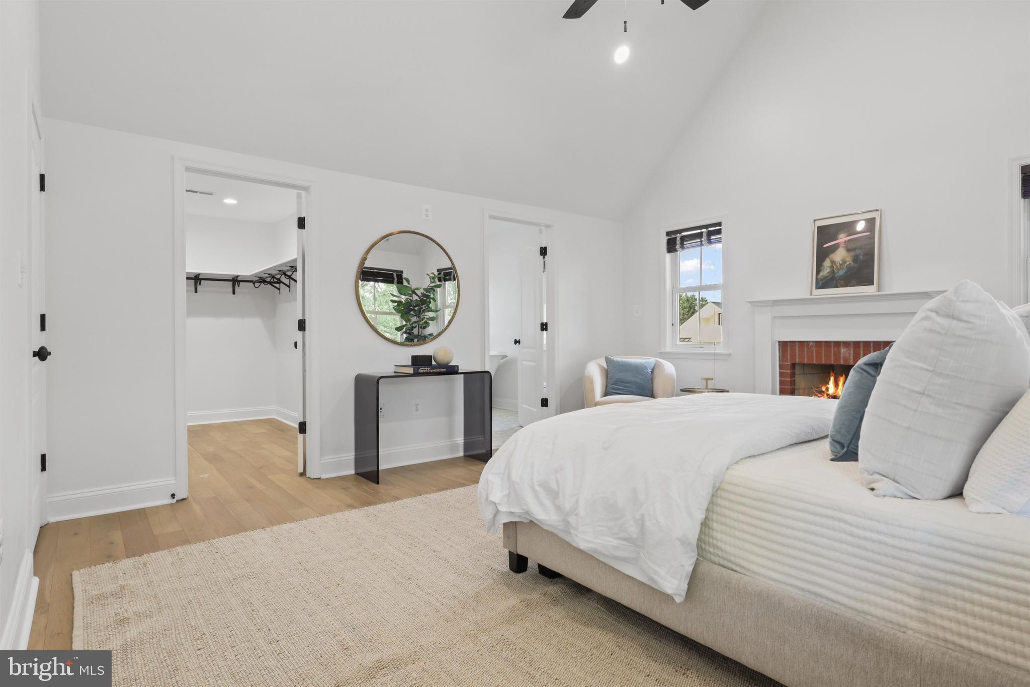 438 Ethan Allen Avenue Takoma Park, MD 20912 - Photo 14 of 47 a bedroom with a bed a mirror and a table