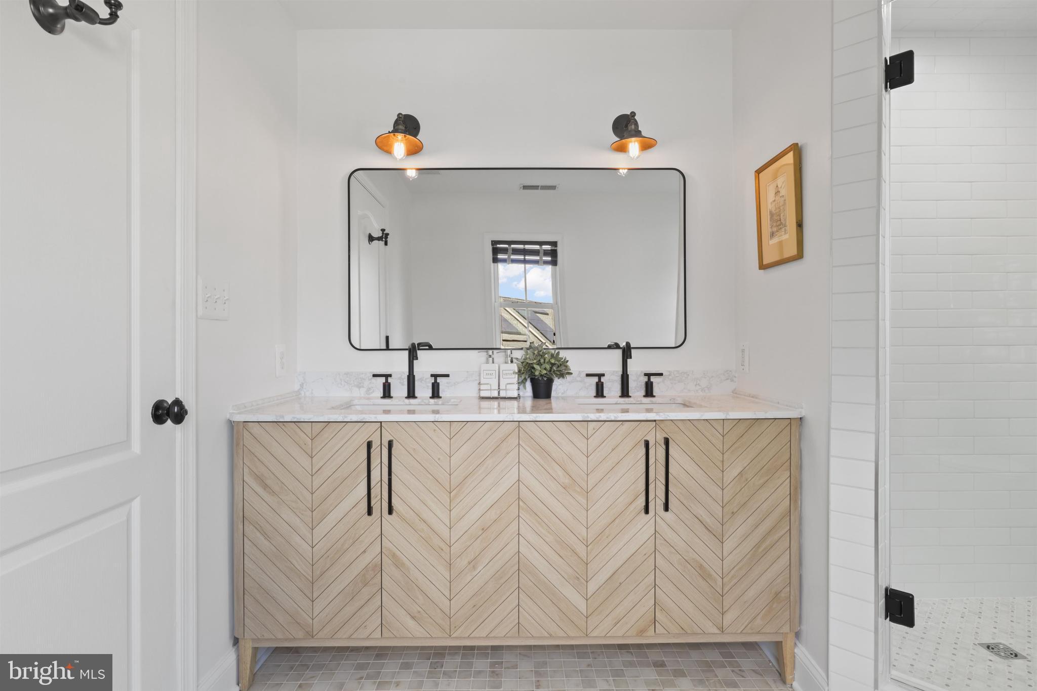 438 Ethan Allen Avenue Takoma Park, MD 20912 - Photo 15 of 47 a bathroom with a sink and a mirror