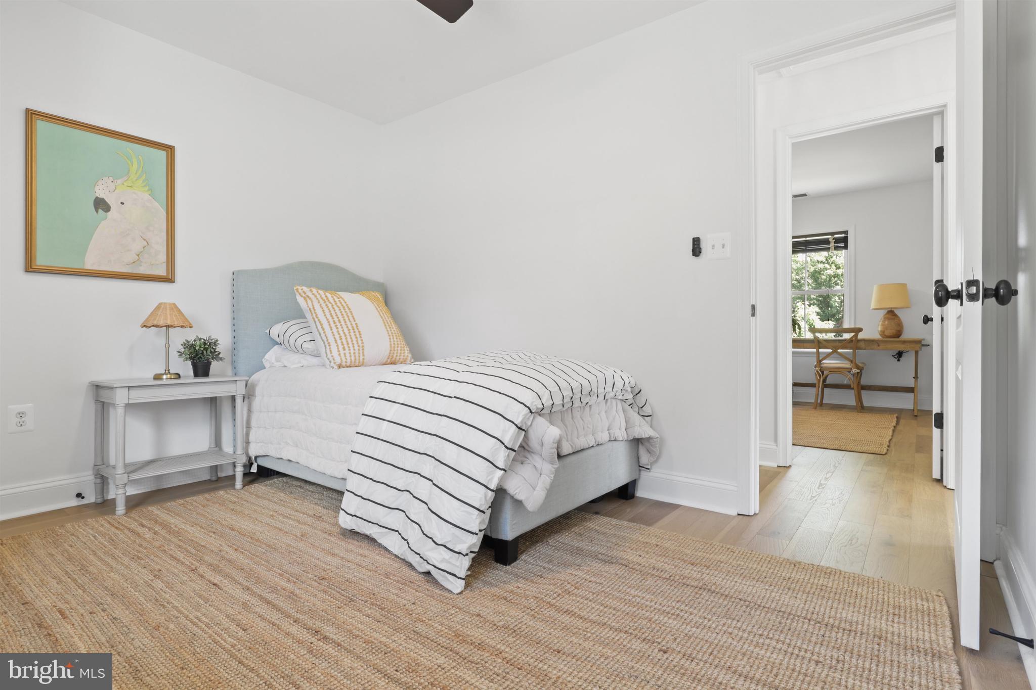 438 Ethan Allen Avenue Takoma Park, MD 20912 - Photo 17 of 47 a bedroom with a bed and a table