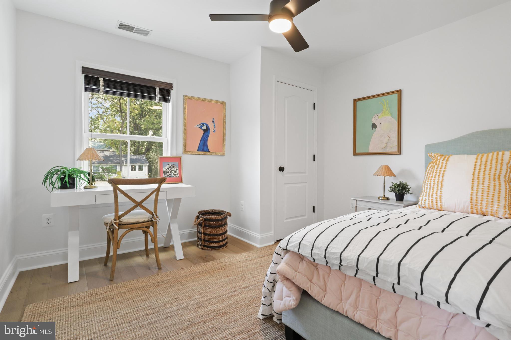 438 Ethan Allen Avenue Takoma Park, MD 20912 - Photo 18 of 47 a bedroom with a bed and a table