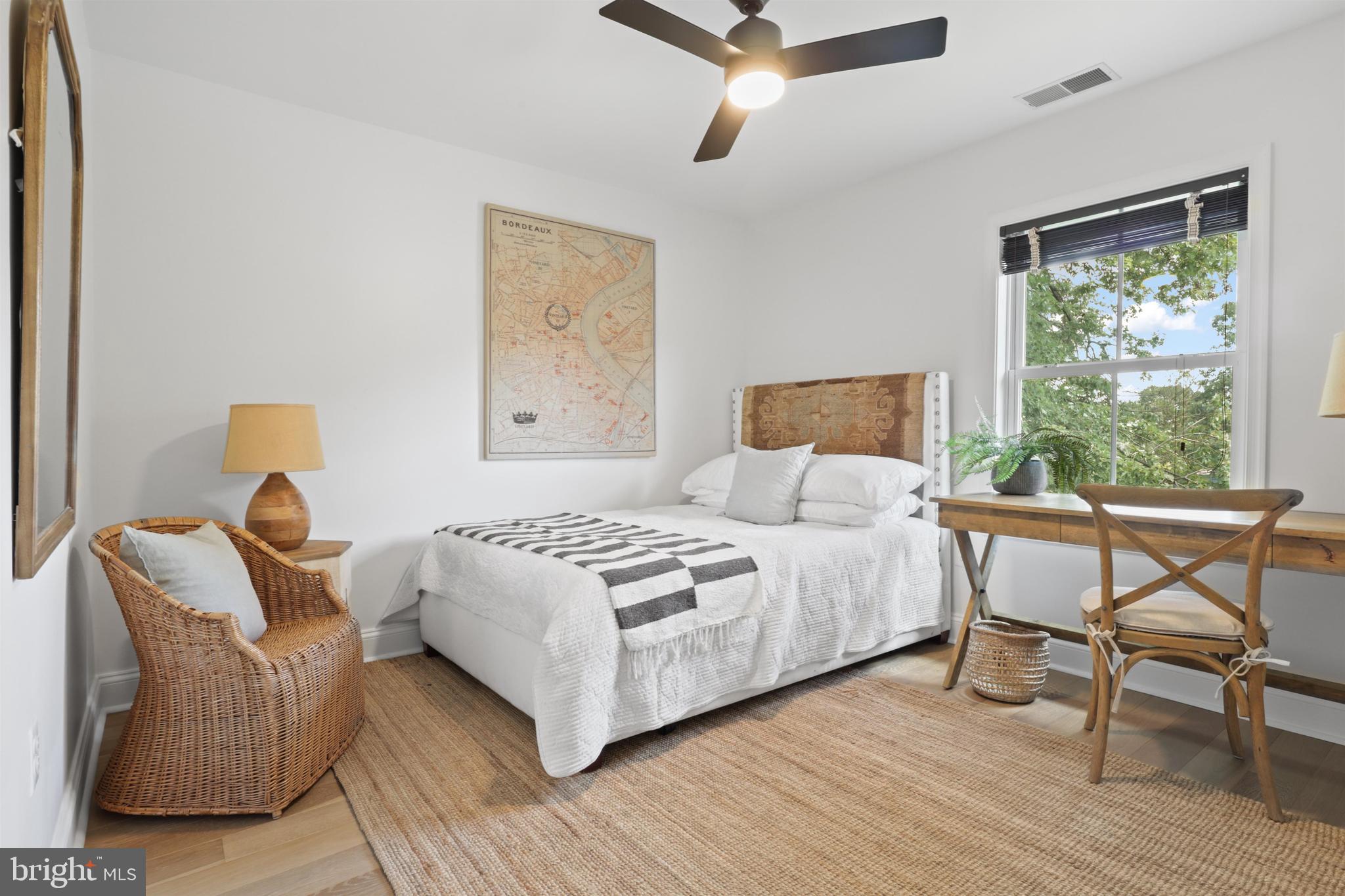 438 Ethan Allen Avenue Takoma Park, MD 20912 - Photo 20 of 47 a bedroom with a bed and wooden floor