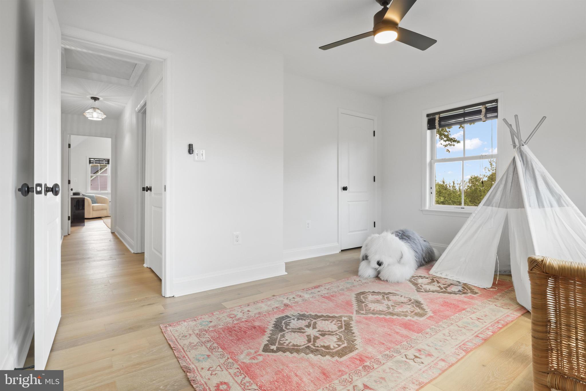 438 Ethan Allen Avenue Takoma Park, MD 20912 - Photo 22 of 47 a bedroom with a bed and wooden floor