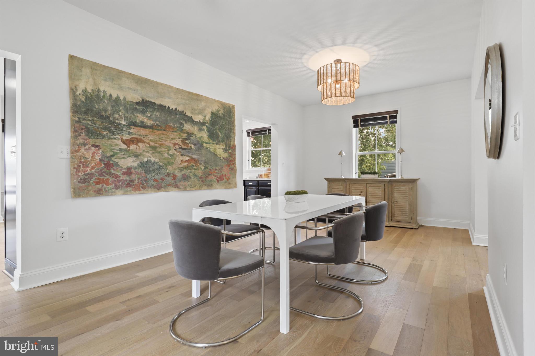 438 Ethan Allen Avenue Takoma Park, MD 20912 - Photo 6 of 47 a view of a dining room with furniture a chandelier and wooden floor