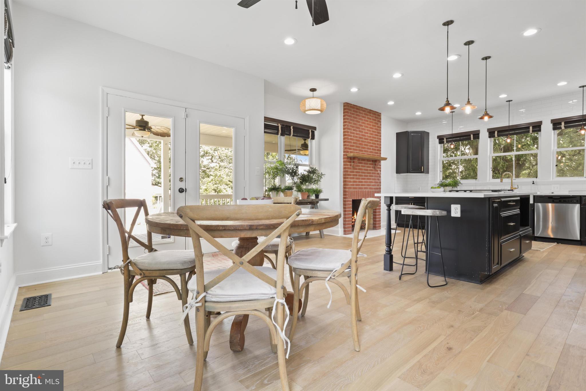 438 Ethan Allen Avenue Takoma Park, MD 20912 - Photo 9 of 47 a dining area with a table chairs and a kitchen view