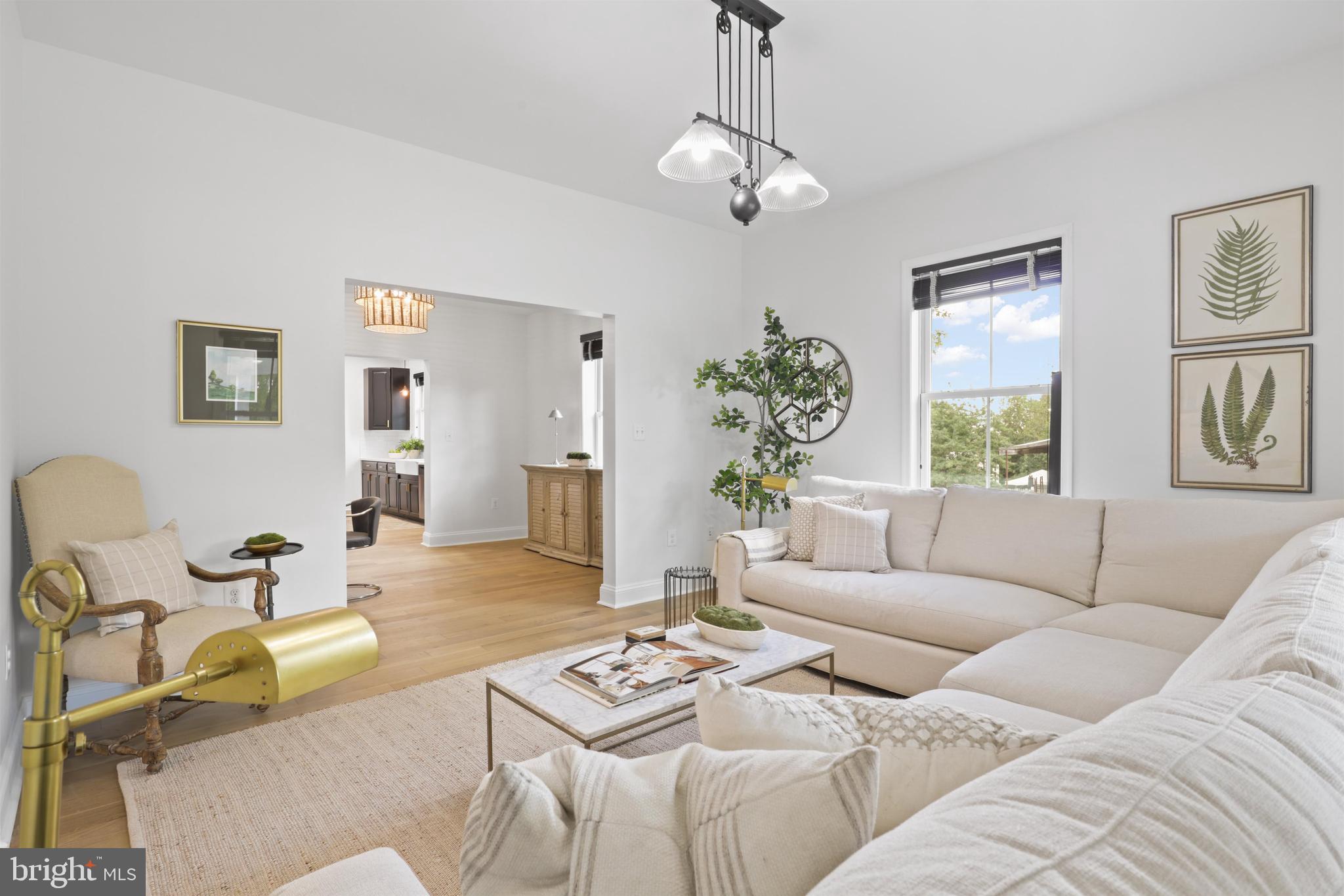 438 Ethan Allen Avenue Takoma Park, MD 20912 - Photo 10 of 47 a living room with furniture a dining table and a window
