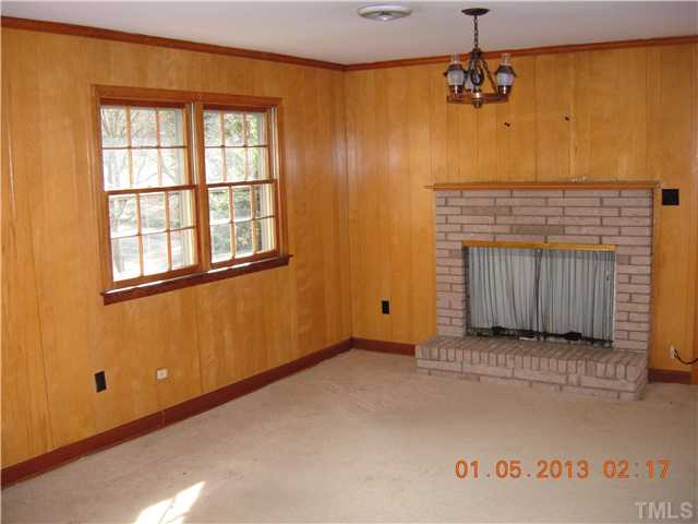 4135 Rockingham Street Raleigh, NC 27609 - Photo 4 of 11 an empty room with windows
