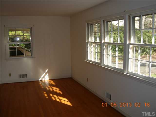 4135 Rockingham Street Raleigh, NC 27609 - Photo 6 of 11 a view of an empty room with a window