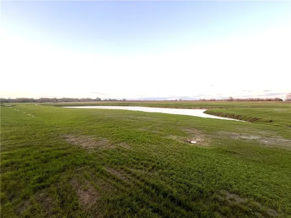 a view of a lake with a big yard
