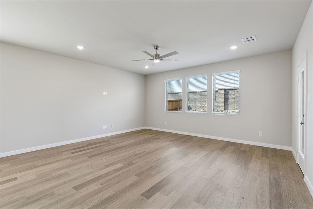 7716 Kingfisher Road Aubrey, TX 76227 - Photo 16 of 39 Living Room in the Holden home plan by Trophy Signature Homes – REPRESENTATIVE PHOTO