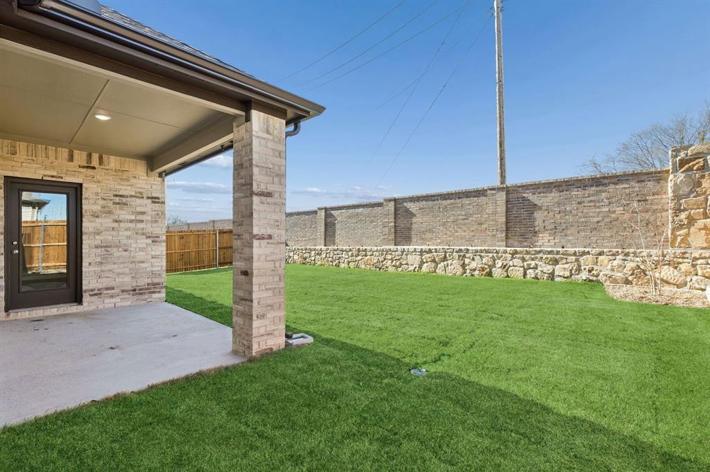 7716 Kingfisher Road Aubrey, TX 76227 - Photo 37 of 39 Patio in the Holden home plan by Trophy Signature Homes – REPRESENTATIVE PHOTO