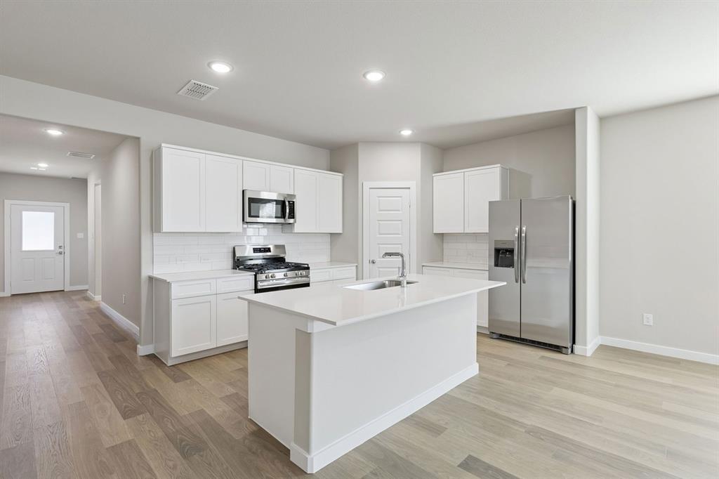 7716 Kingfisher Road Aubrey, TX 76227 - Photo 6 of 39 Kitchen in the Holden home plan by Trophy Signature Homes – REPRESENTATIVE PHOTO