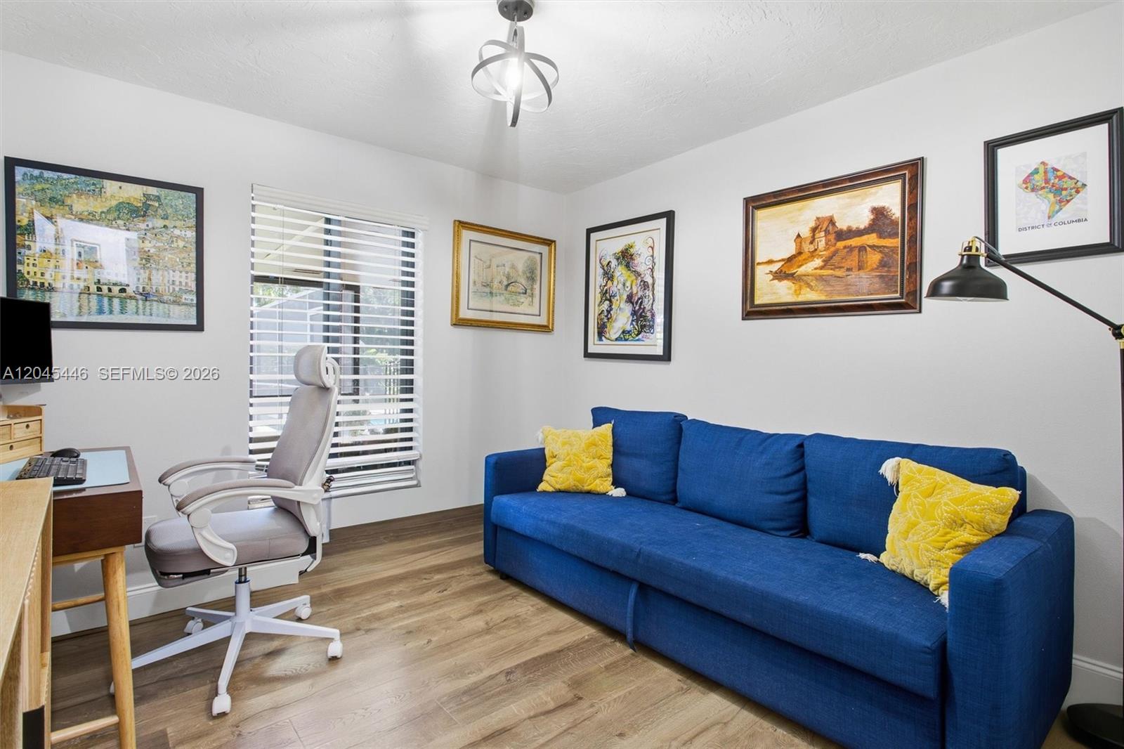8440 Southwest 180th Street Palmetto Bay, FL 33157 - Photo 17 of 54 a living room with furniture and a flat screen tv