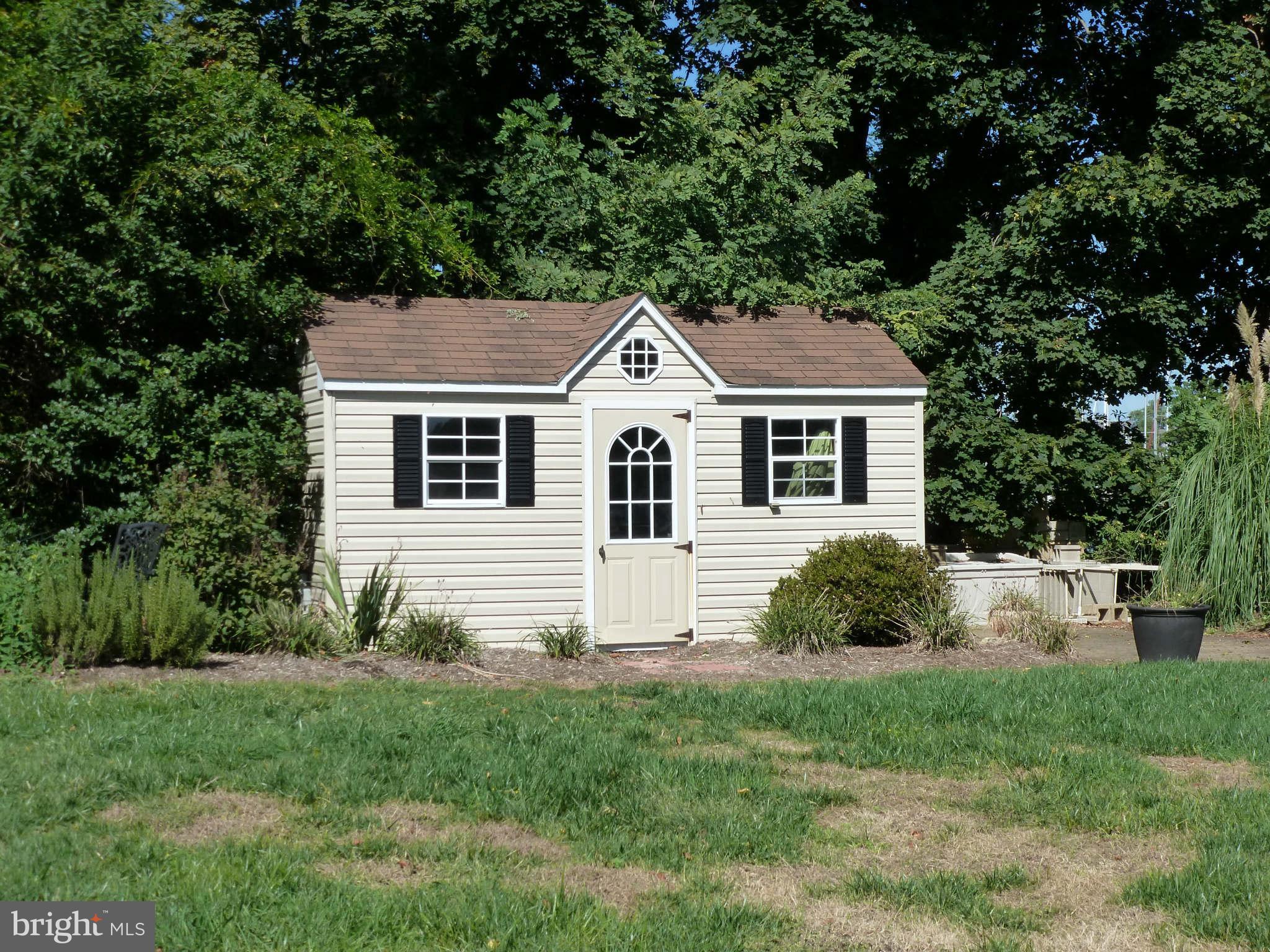 8095 Ventnor Road Pasadena, MD 21122 - Photo 25 of 30 Large shed with wide door at side